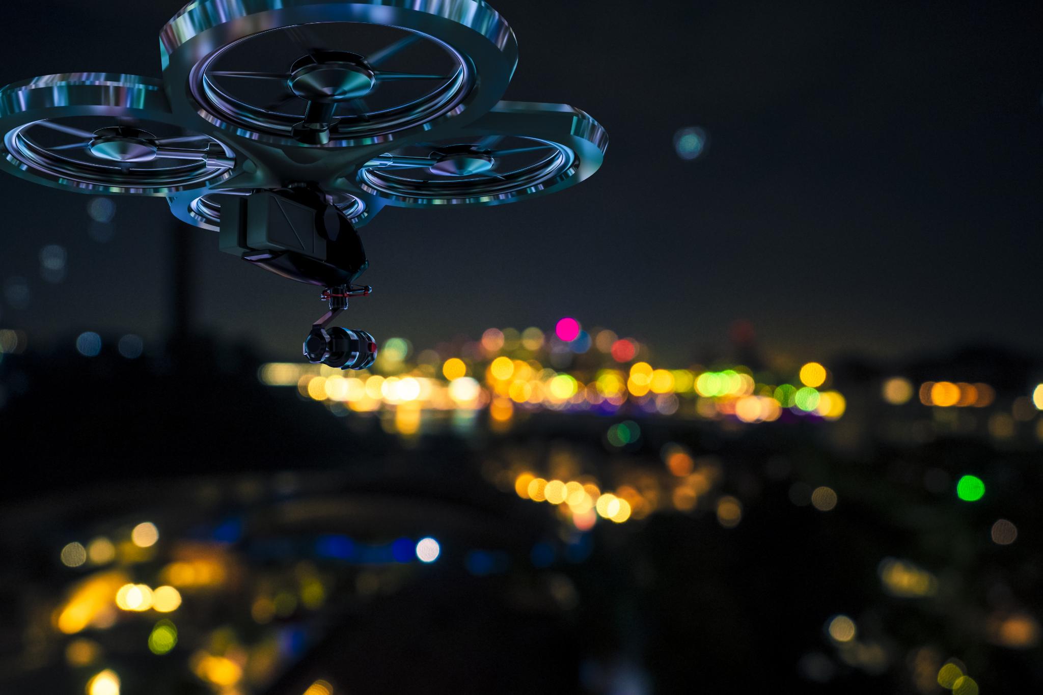 Drone capturing aerial footage over a city